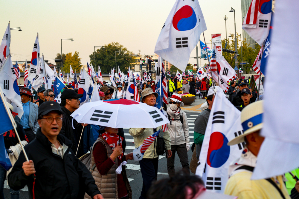 Tradematics | Bitcoin Record High Clashes with Political Unrest in South Korea